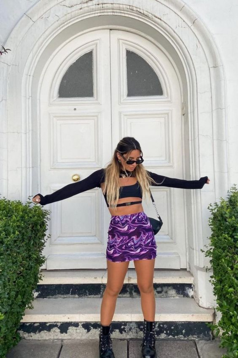 beauty, coachella valley music and arts festival, festival outfit ideas, music festival, purple and violet t-shirt, purple and violet sportswear short, black casual boot chelsea and ankle boot