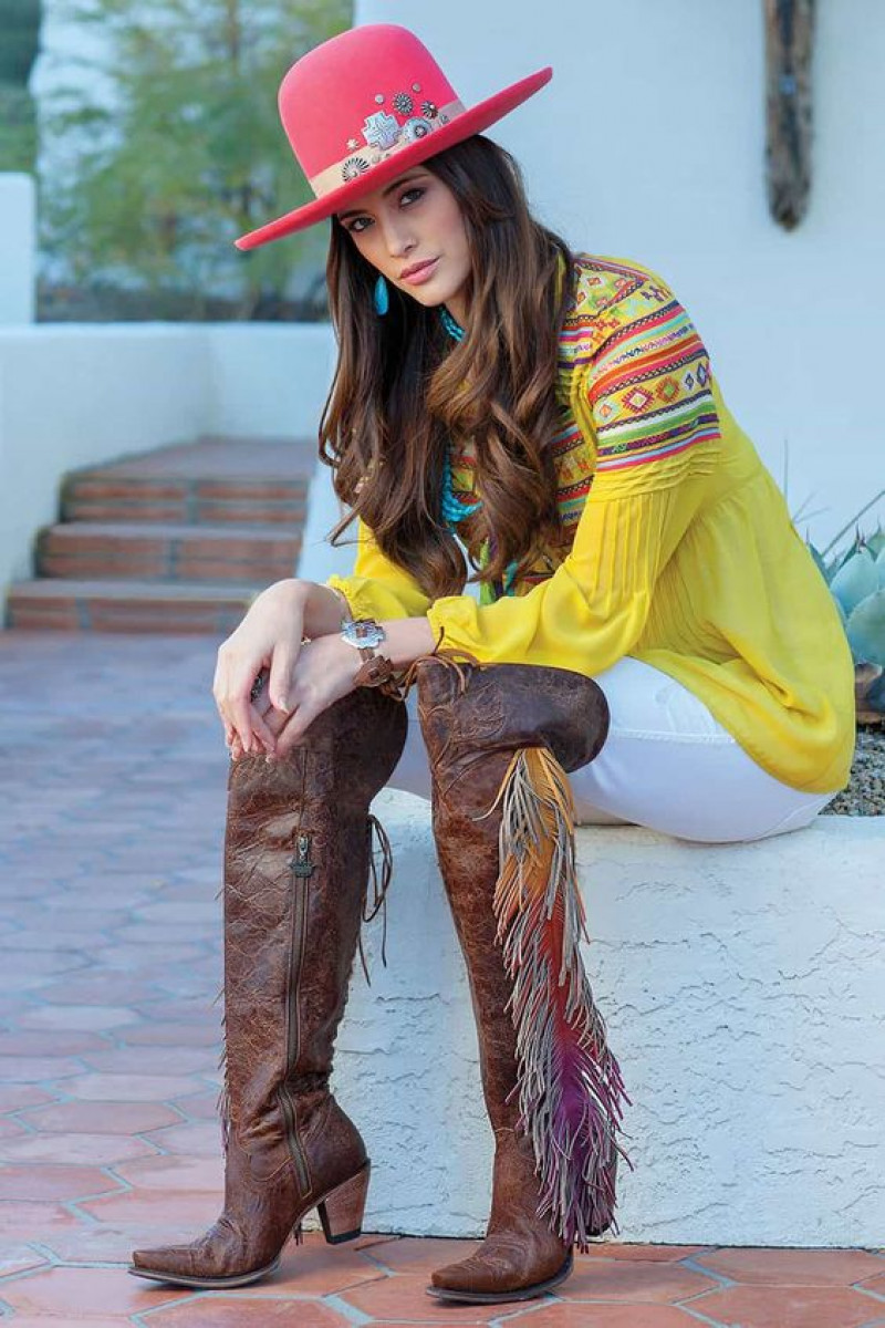 yellow top and brown boots