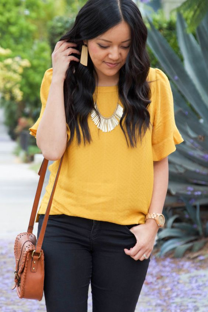 yellow sweater, black jeans