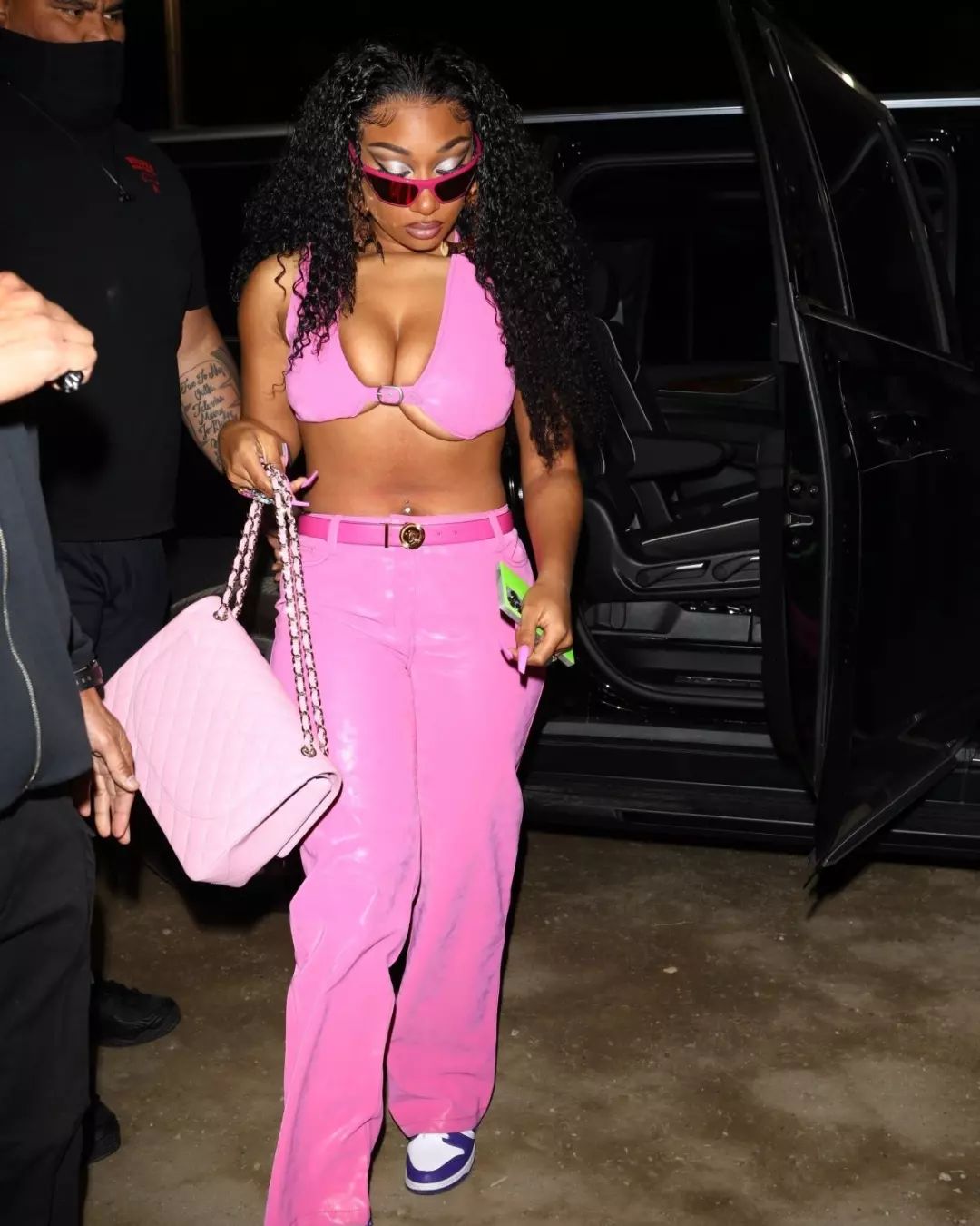 Megan Thee Stallion in a Bold Pink Crop Top and Matching Pants