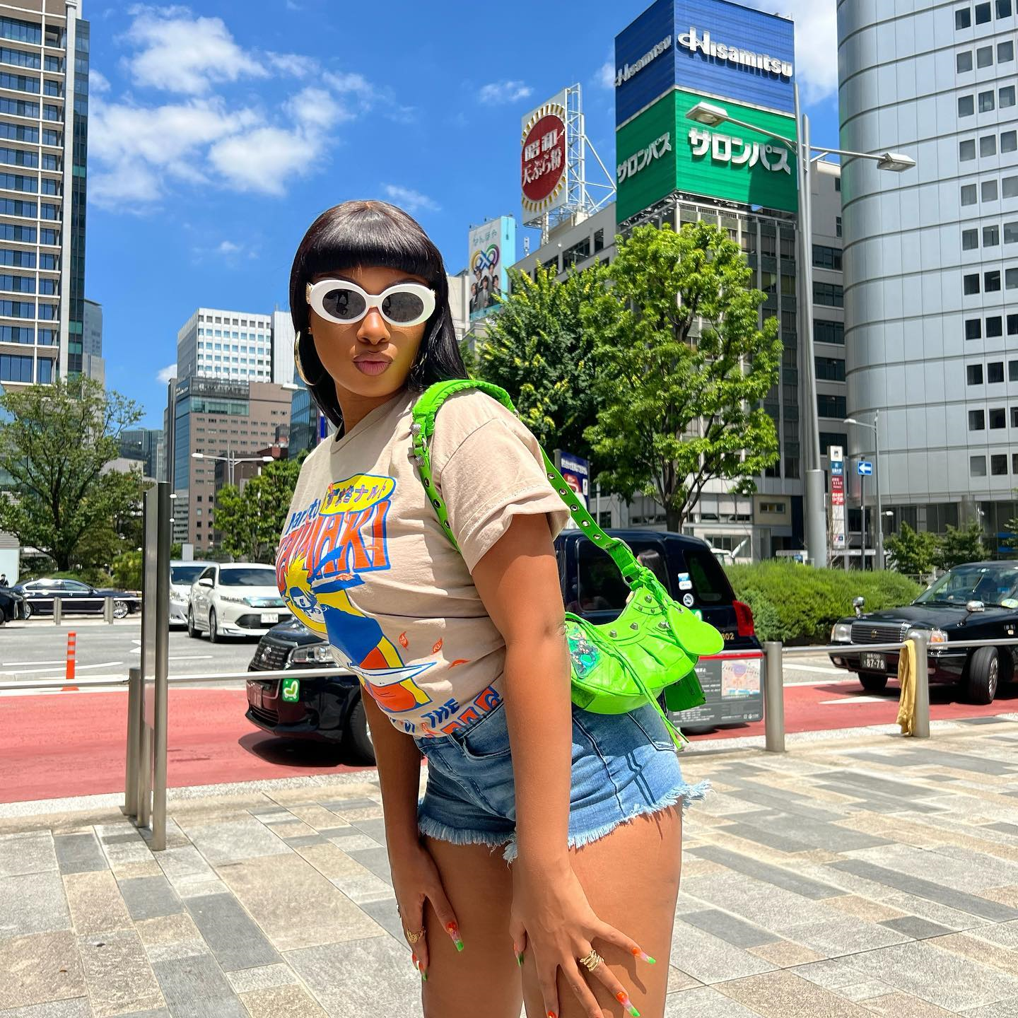 In a Graphic Tee and Denim Shorts