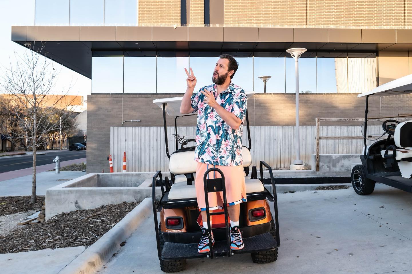 Floral Hawaiian Shirt with Pink Shorts and Multicolored Sneakers