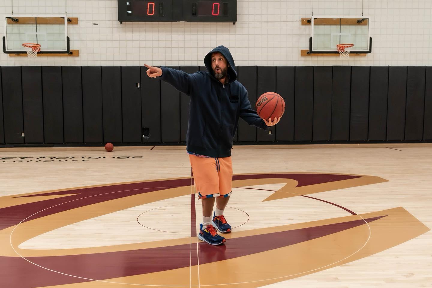 Navy Hoodie with Orange Shorts and Blue Sneakers